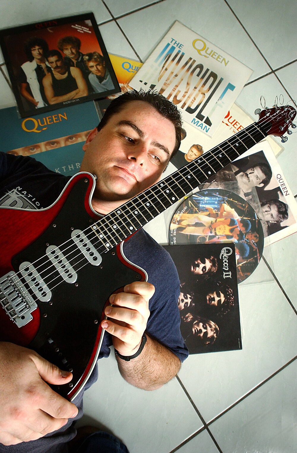James Barber showing off his Queen Musical collection and electric guitar, Ipswich, June 2003