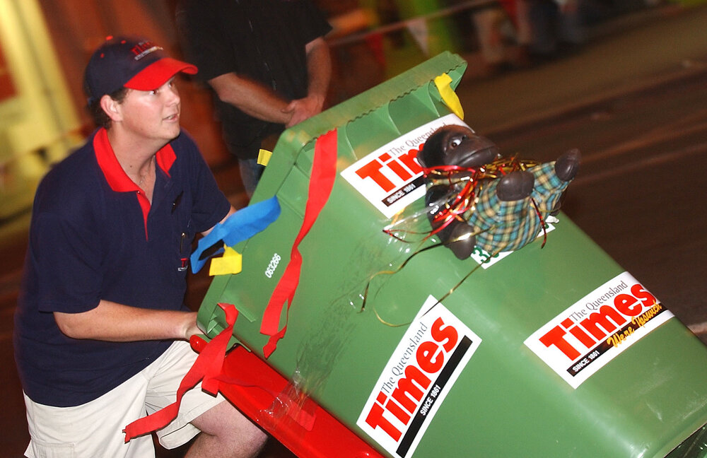 Wheelie bin racing event with participators Tim Everding, Stephen Austin, Russell and Kaisha Leigh, Queensland Times member and Ipswich's Own member race, and John Lewis and Brenden Webb with their billy cart, Ipswich, June 2003