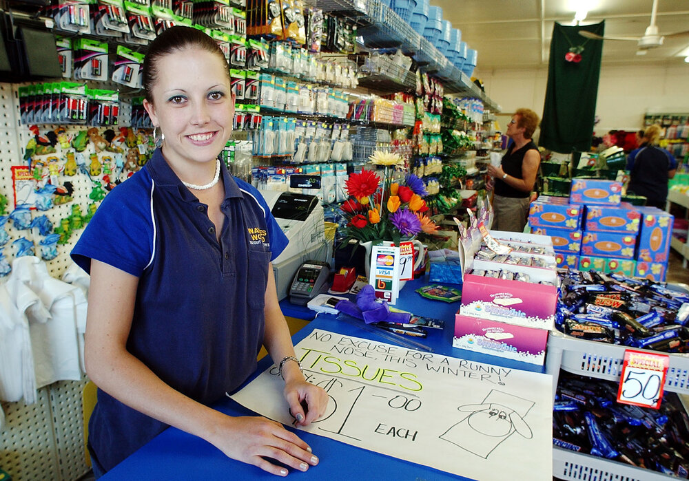 Unidentified woman working at a convenience store, Ipswich, June 2003