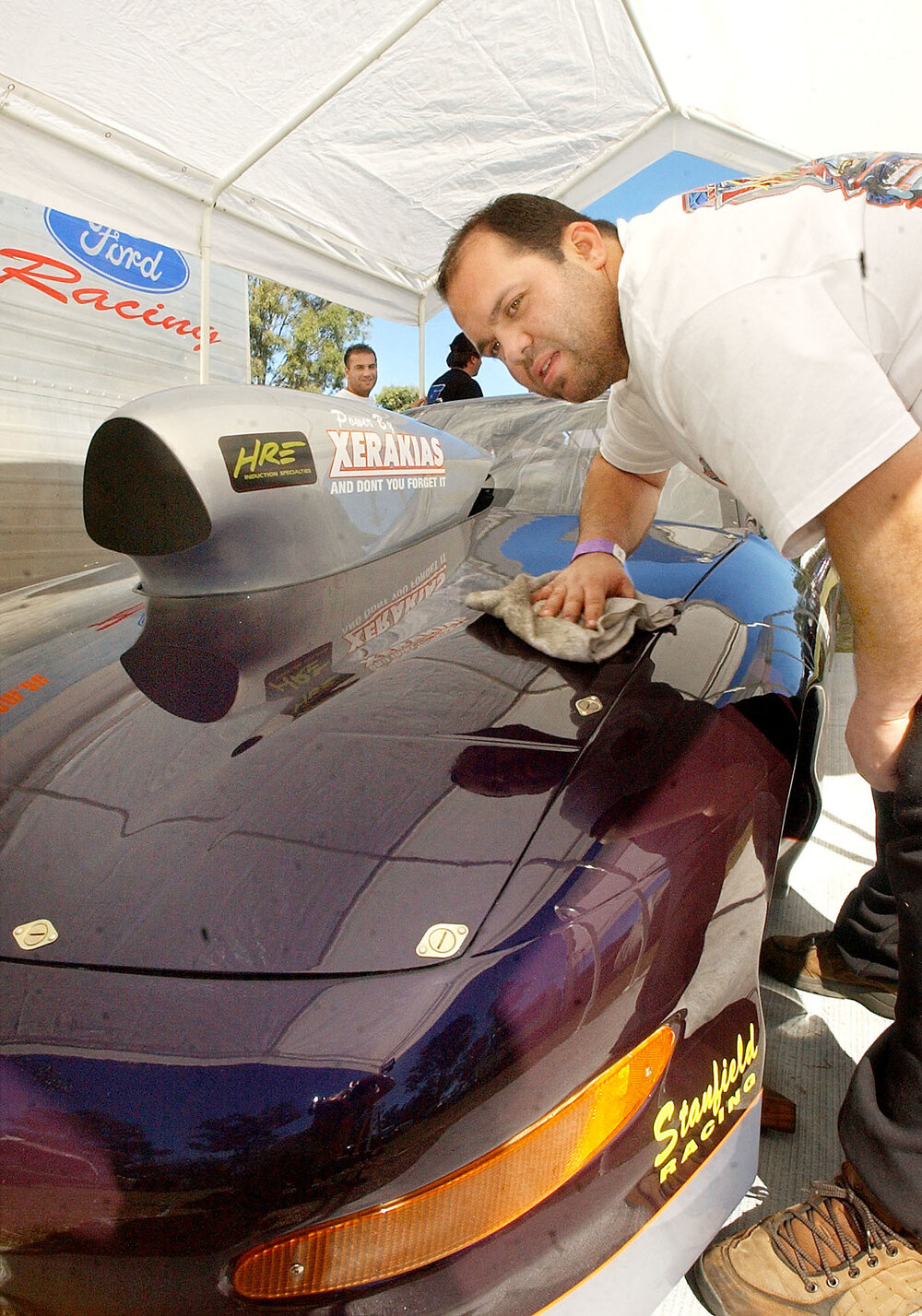 Adrian Gallo polishing up the Xerakias Team drag racing car, Ipswich, June 2003 