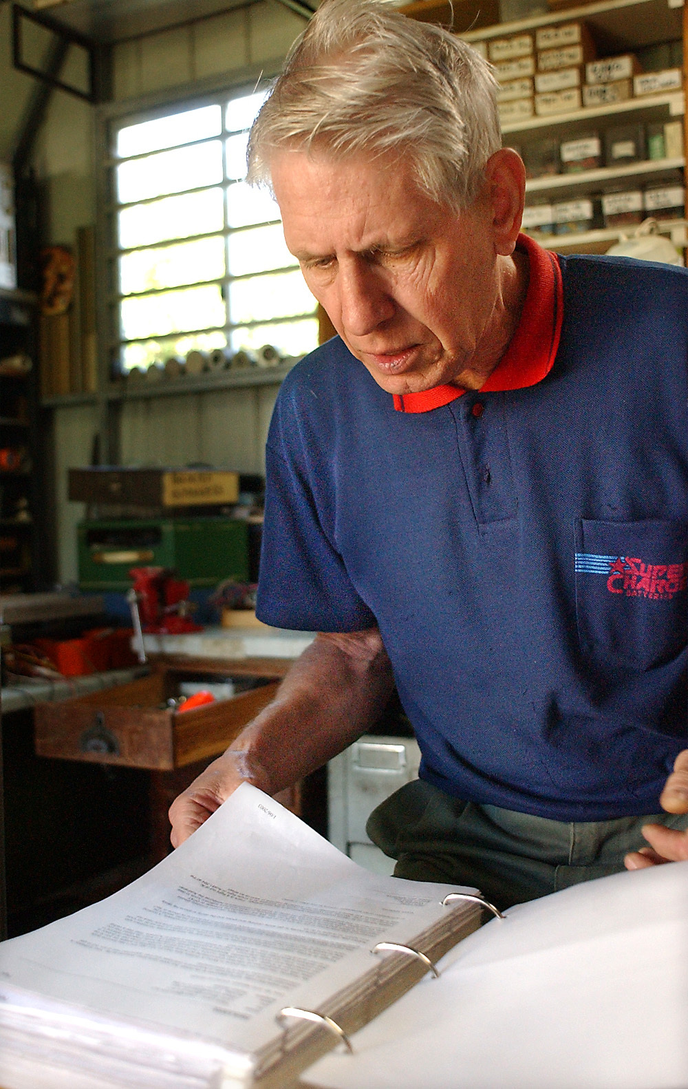 Hans Laroo going through a book, Ipswich, June 2003