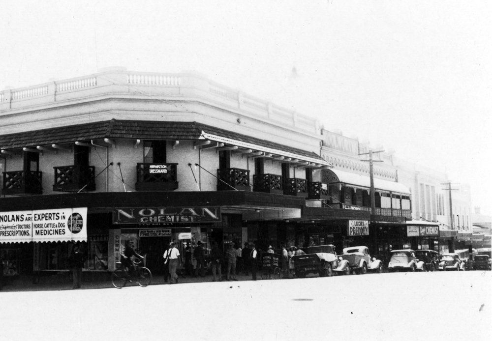 Streetscape of business along Brisbane Street, between Nicholas and Bell Streets, Ipswich, 1940s