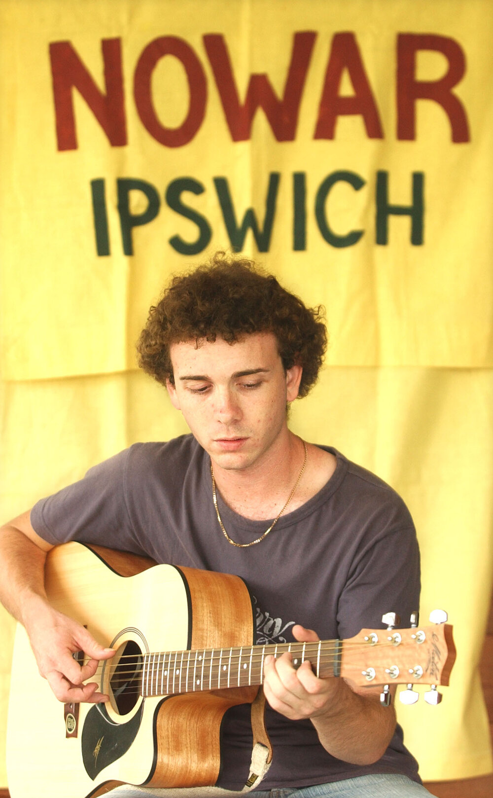 James Grehan playing the guitar at Nowar Ipswich, Ipswich, February 2003