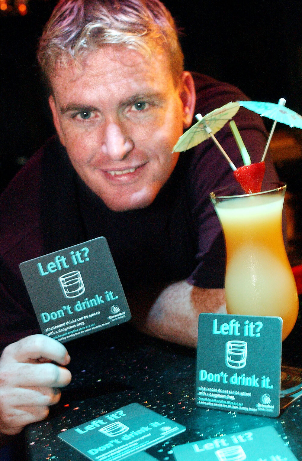 Michael Matz at Players Nightclub with anti-spike information cards from Queensland Government, Ipswich, February 2003
