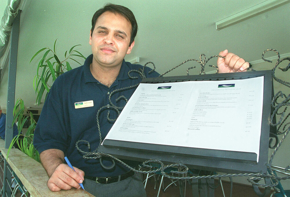 Unidentified man with a menu, Ipswich, February 2003