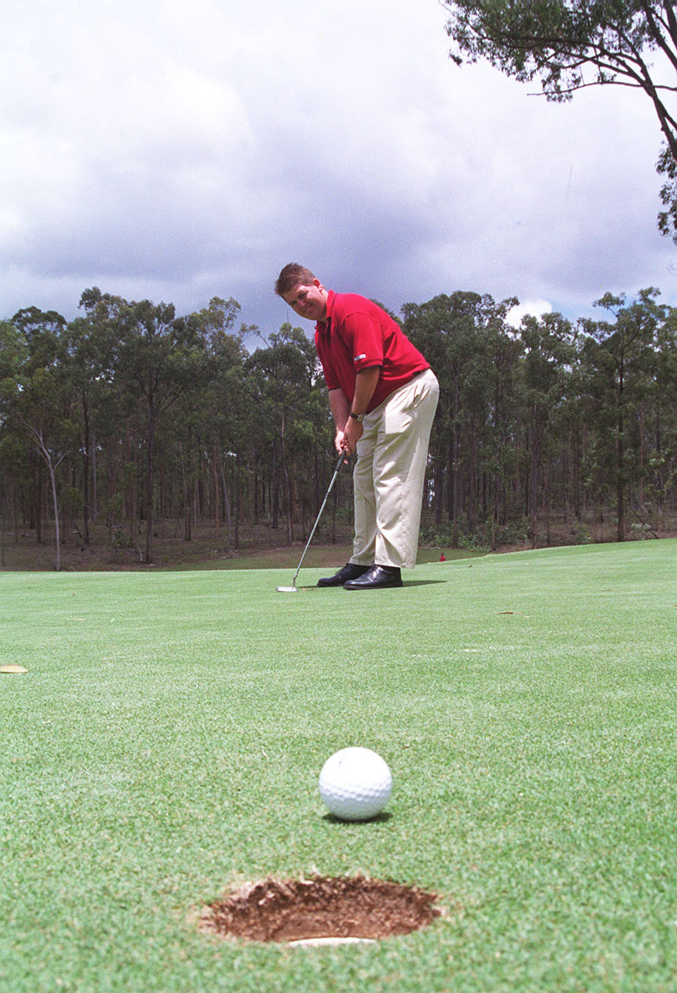 Unidentified man playing golf, Ipswich, February 2003