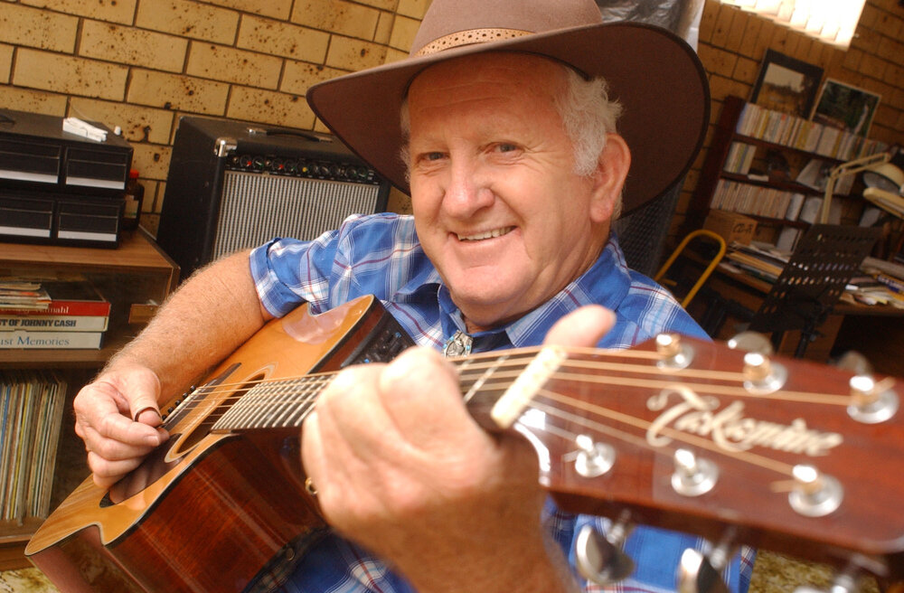 Sel Munt playing the guitar, Ipswich, February 2003