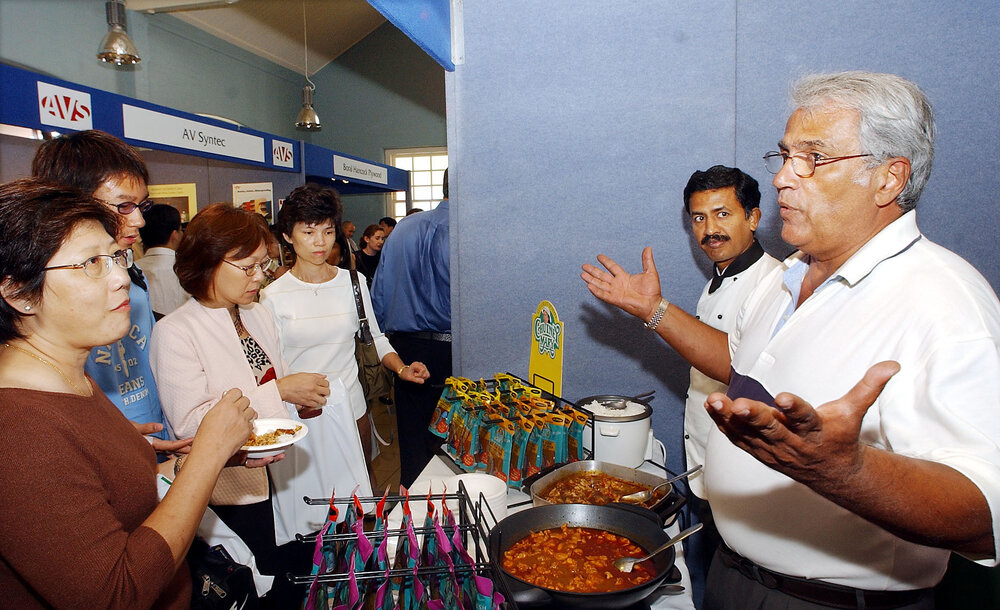 Chris Doutr'e of Chutney Mary advertising curry, Ipswich, March 2003