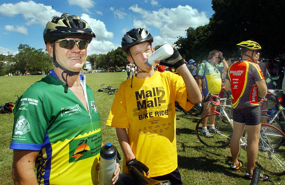 Cyclists Tony Malone and Keith Scribner taking a drink after the bike ride, Ipswich, April 2003