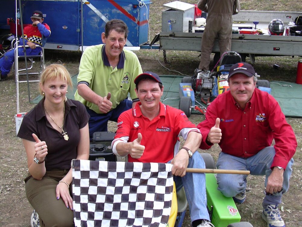 Councillor Cheryl Bromage, Mayor Paul Pisasale, Paul Casos and unidentified man with go-karts and racing gear, Ipswich, April 2003