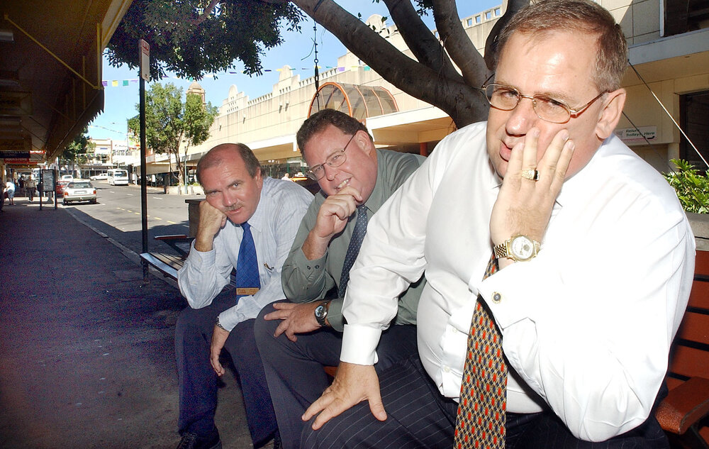 Paul Casos and two unidentified men waiting for the bus, Bell Street, Ipswich, April 2003