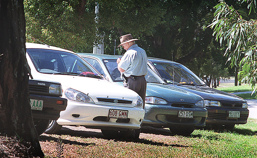 Officer giving out parking fines at the hospital, Ipswich, April 2003