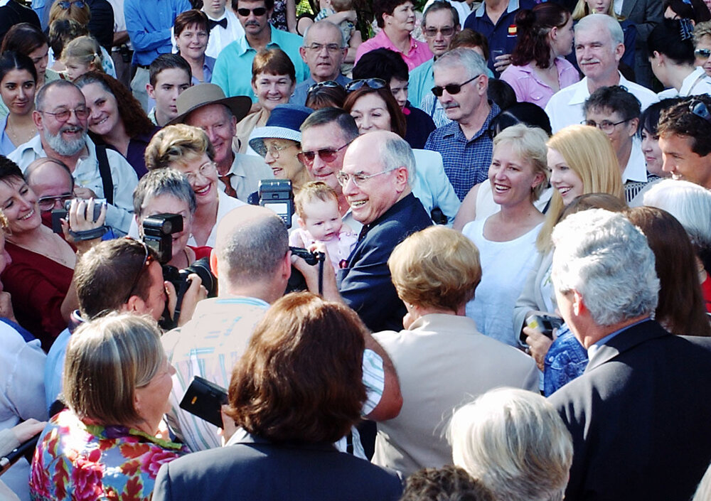 Crowd surrounding Prime Minister John Howard, thought to be at Queensland Government House (Fernberg), Brisbane, April 2003
