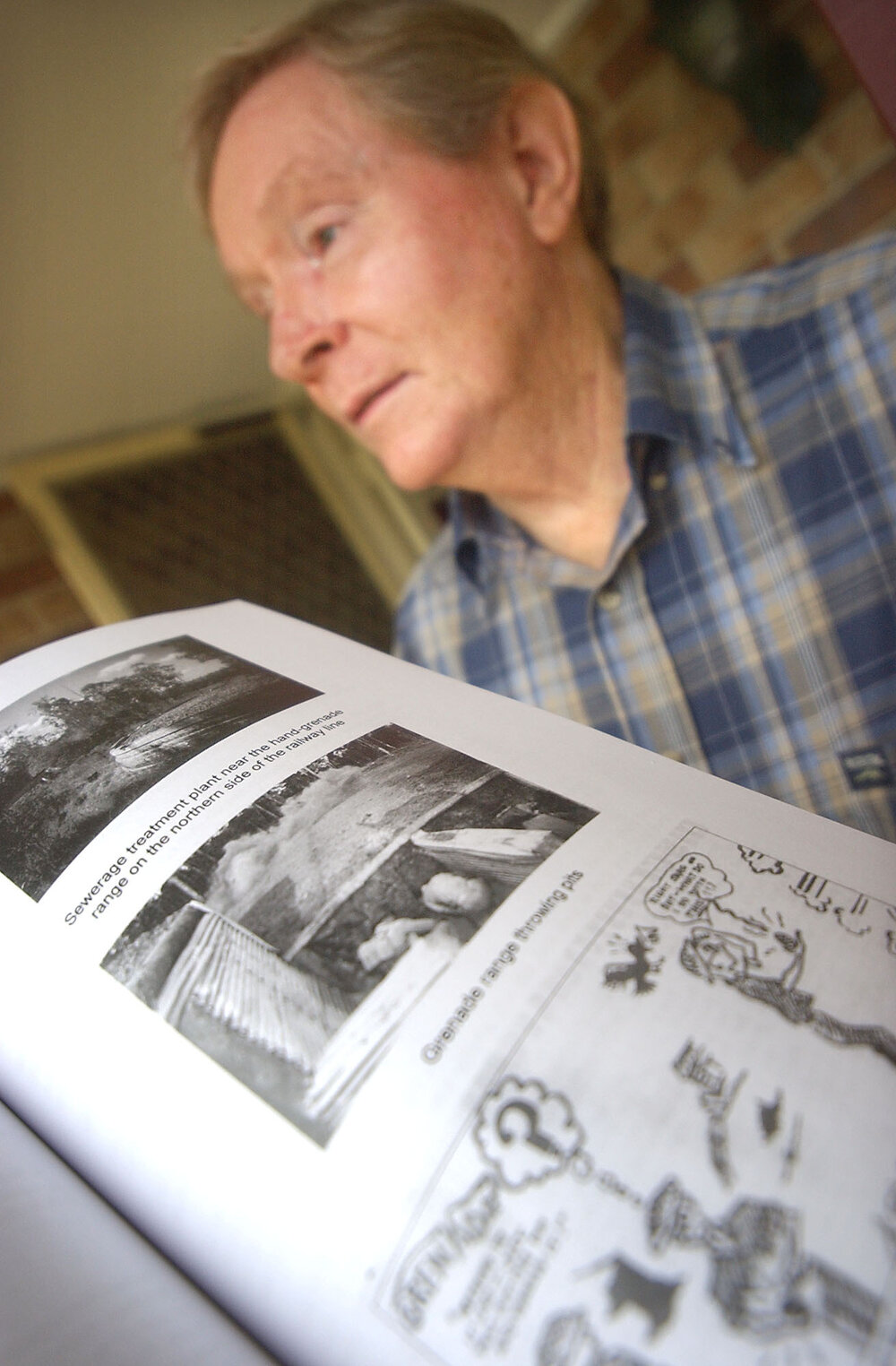 Author, Dr Noel Wallis with his book from the Wacol Army camp, Ipswich, April 2003