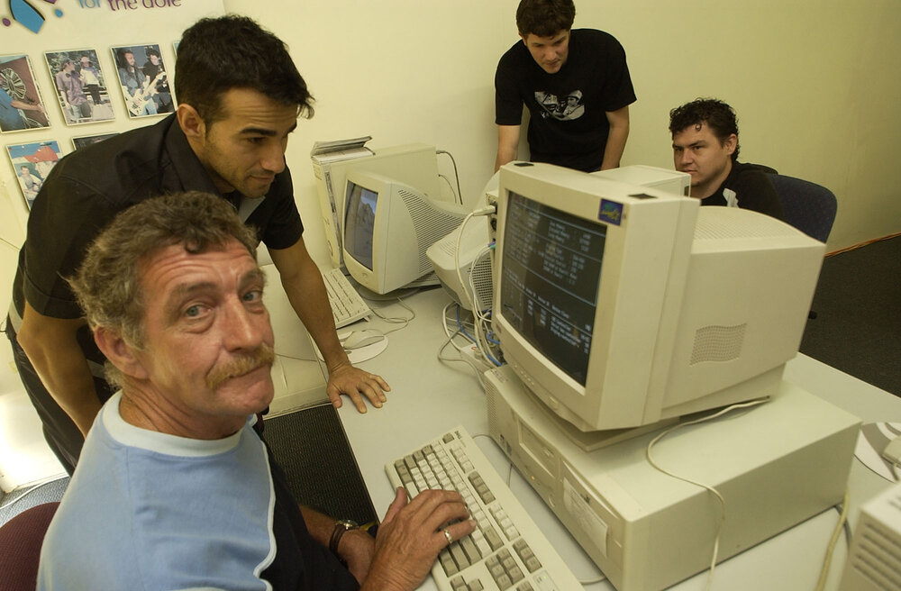 Ashley Kay, Martin Parfitt, Adrian Arcidiacono and Christopher Suthers on computers, Ipswich, November 2003