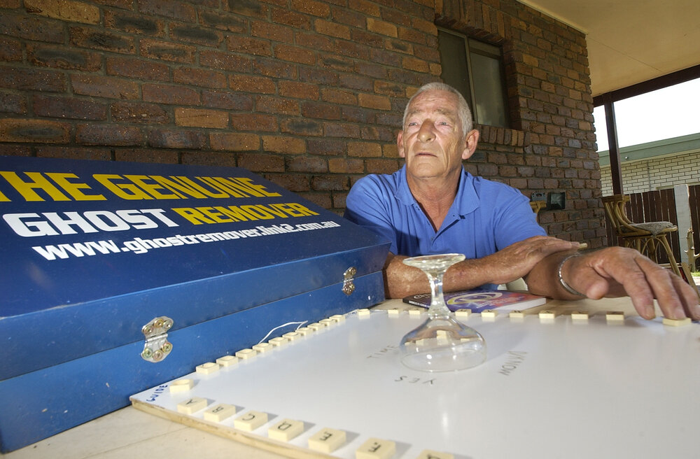 John Salter next to a "Ghost remover" box, Ipswich, November 2003