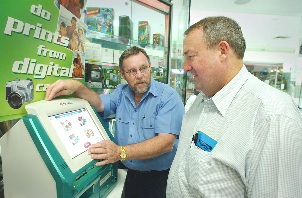 Owner of Heritage City Photos, Mike Rickards and President of the Ipswich Photographic Society, Wayne McDonnell at an information night at Heritage Photo, Ipswich, November 2003