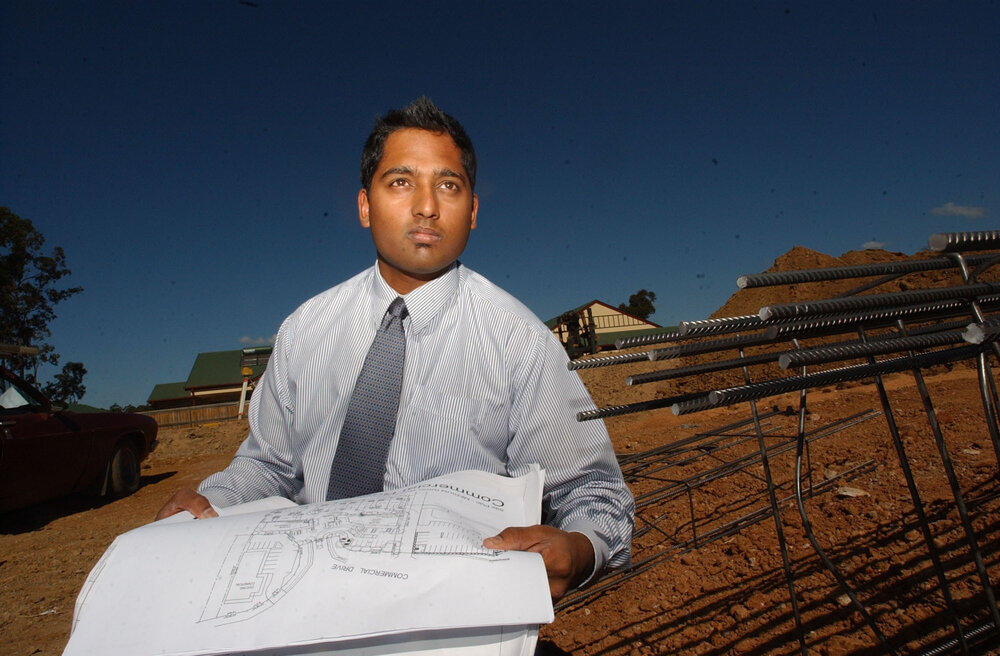 Naren Sinnathamby with construction plans, Springfield, Ipswich, August 2003