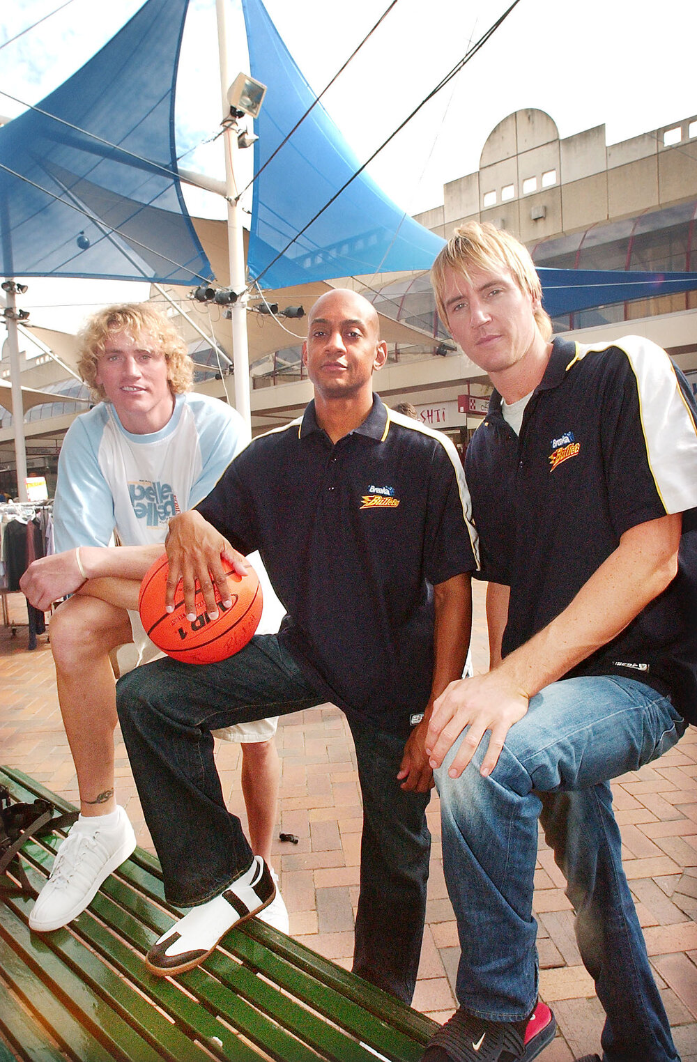 Three unidentified men from Brisbane Bullets basketball team, Ipswich Mall, Ipswich, August 2003