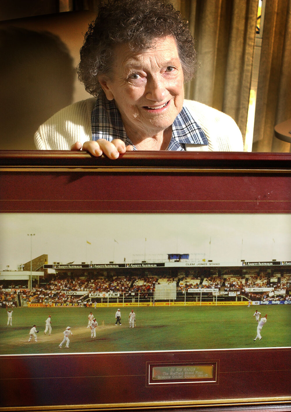 Zillah Norrak with an image of the Sheffield Shield Final cricket match, Ipswich, August 2003