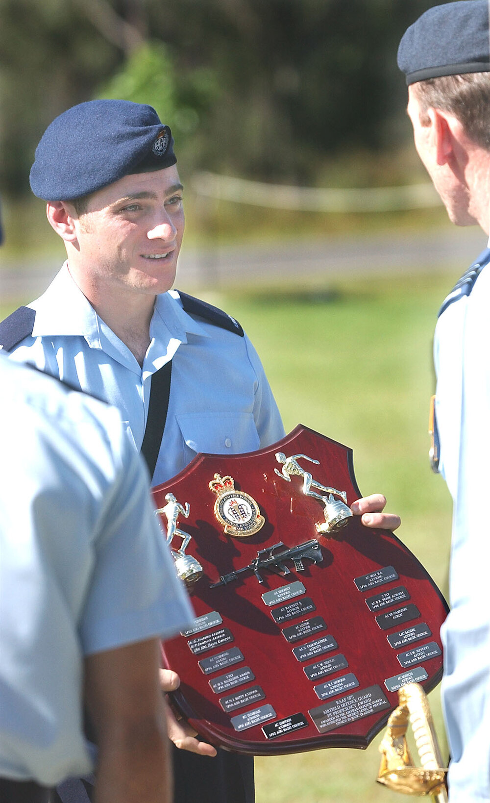 Thought to be named Mooney, holding an award from the Royal Australian Air Force, Ipswich, May 2003