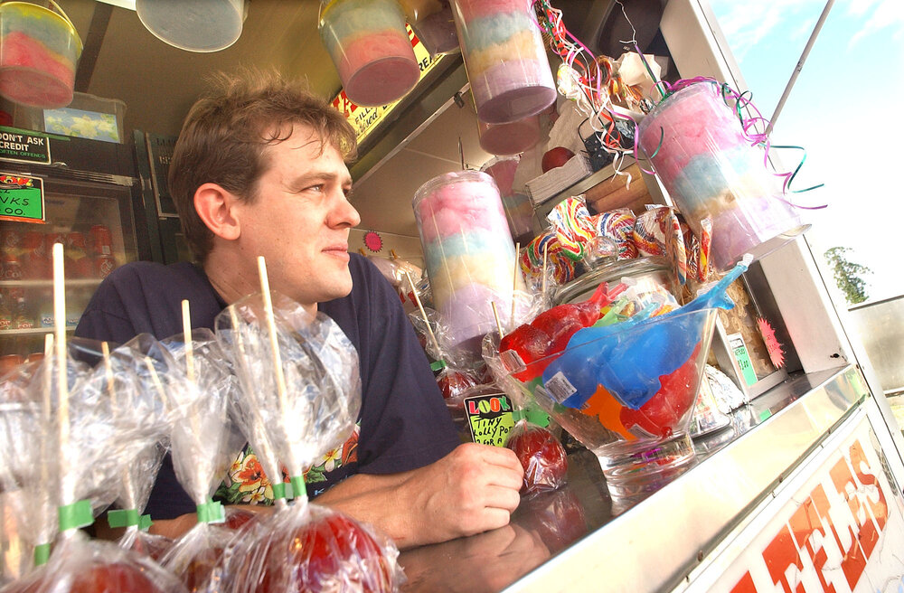 Unidentified man and woman selling snacks at Ipswich show, Ipswich, May 2003