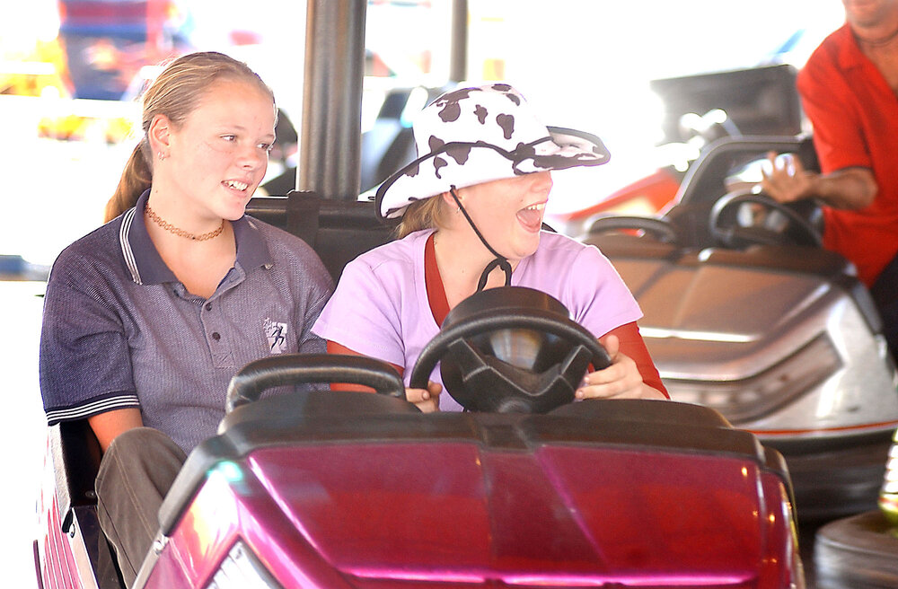 Two unidentified girls on bumper cars at the Ipswich show, Ipswich show, May 2003