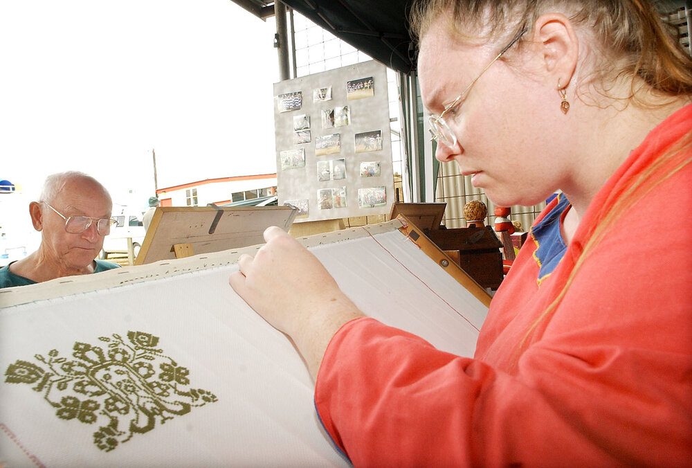 Cheryl Holland doing cross-stitching at the Ipswich show, Ipswich, May 2003