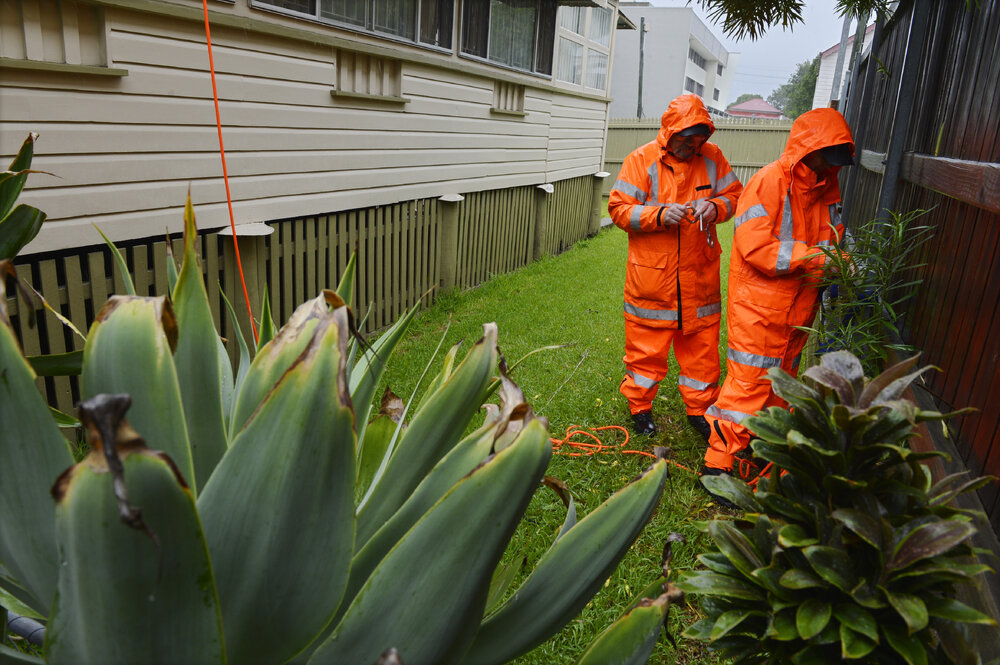 The SES attend to a leaking roof at a Limestone Street property, Ipswich, January 2013