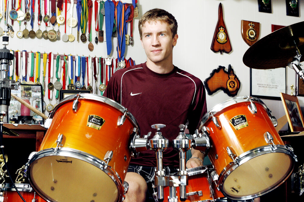 Futsal player Scott Fenn playing the drums, Ipswich, March 2010