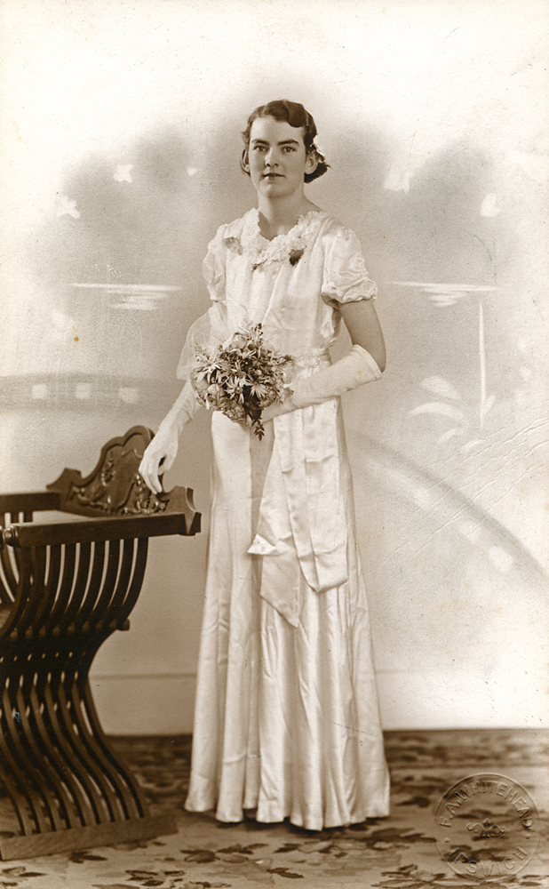 Formal portrait of Connie Kerwin in her debut dress, Ipswich, 1938