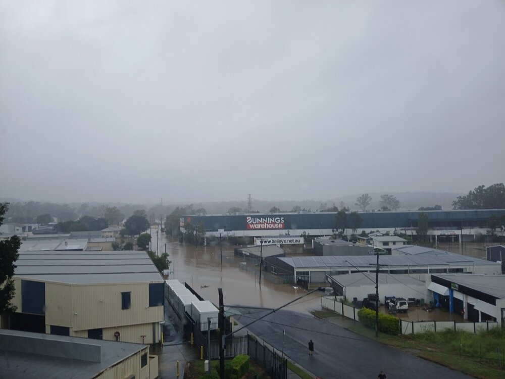 Bundamba Creek in flood, from Bundamba Station overpass, Ipswich, March 2025
