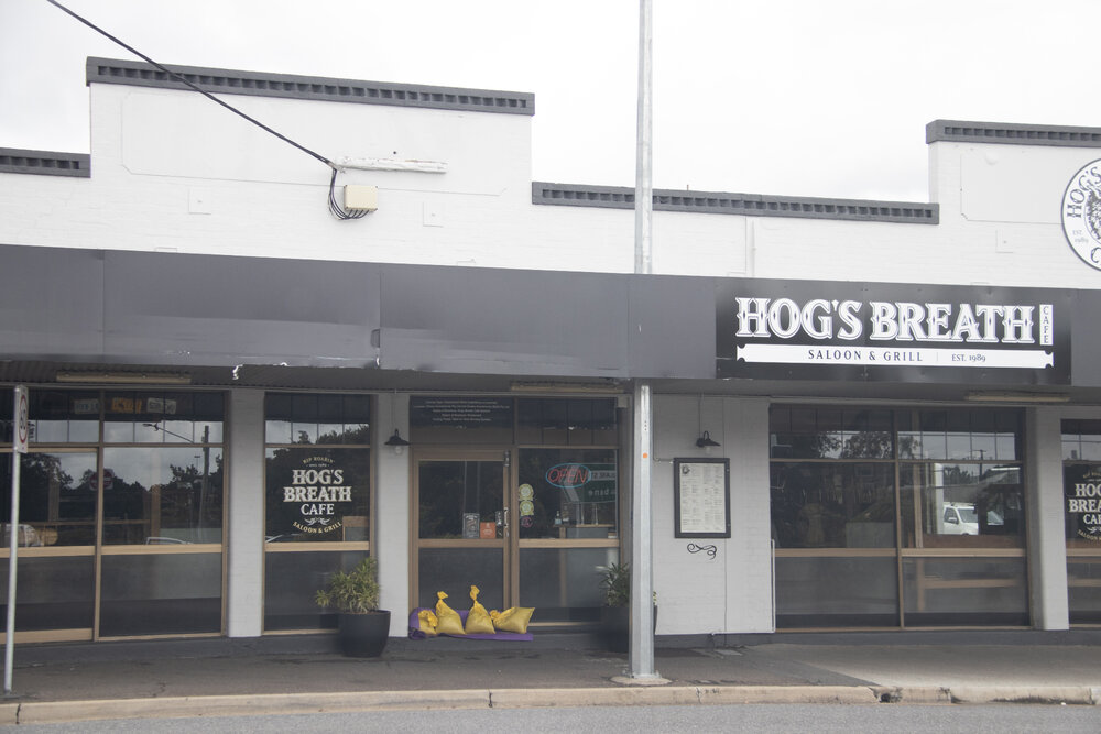 Sandbags against the Hog's Breath Saloon &amp; Grill doors, Brisbane Street, Ipswich, March 2025