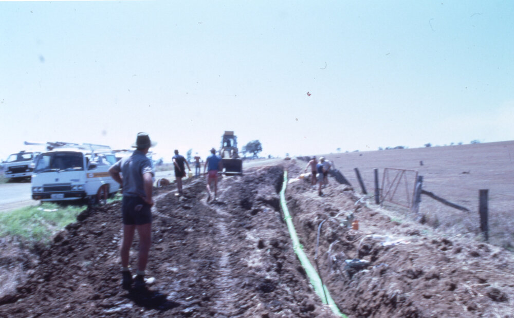 Moreton Shire Council workers laying water pipes in the vicinity of Harrisville, c.1987