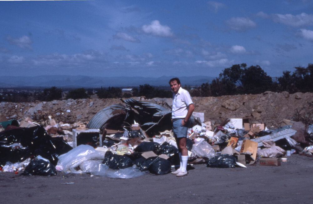 Moreton Shire rubbish tip being inspected by a Health Surveyor, location unknown, c.1987