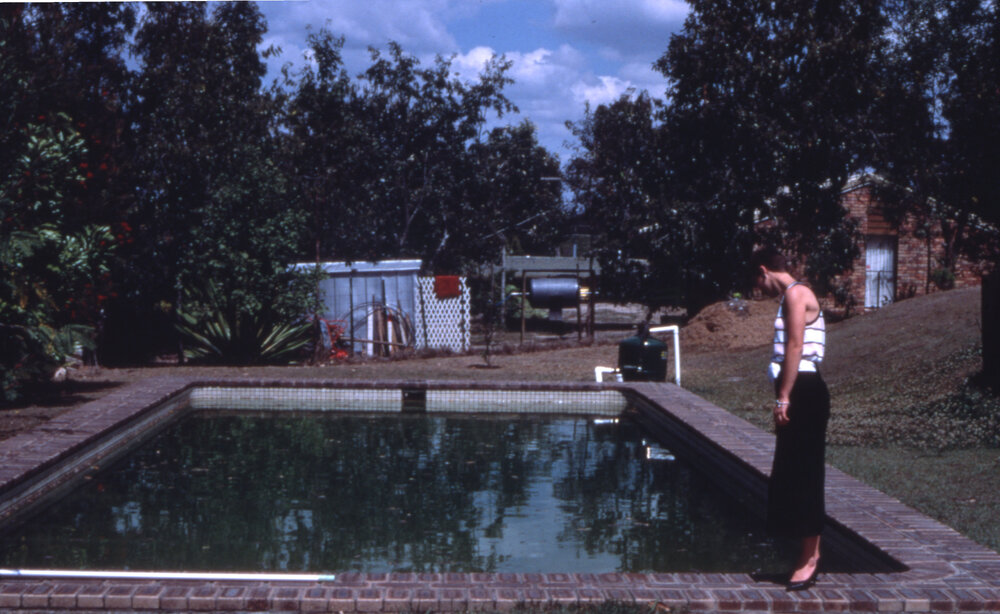 Moreton Shire Council officer inspecting a residential swimming pool, location unknown, c.1987