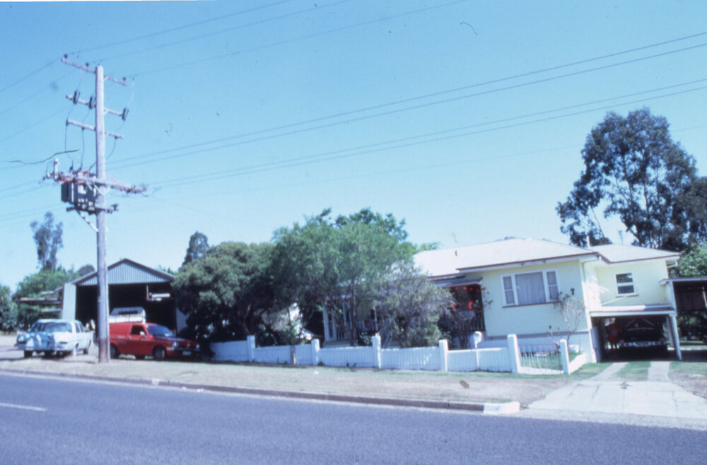Cars awaiting repairs in a suburban street, location unknown, c.1987