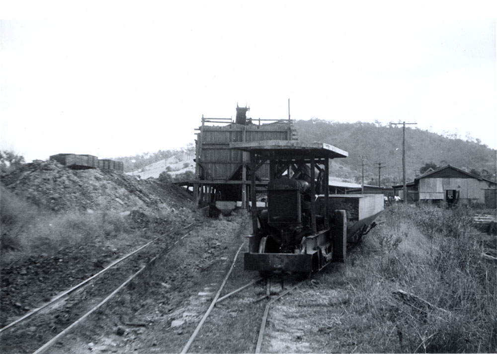 Shuttle train in front of coal loading shute, Caledonian Colliery, Thagoona, Ipswich, 1957
