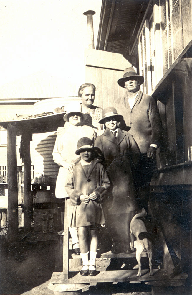 Unidentified family group on steps of home, North Ipswich, early 1930s