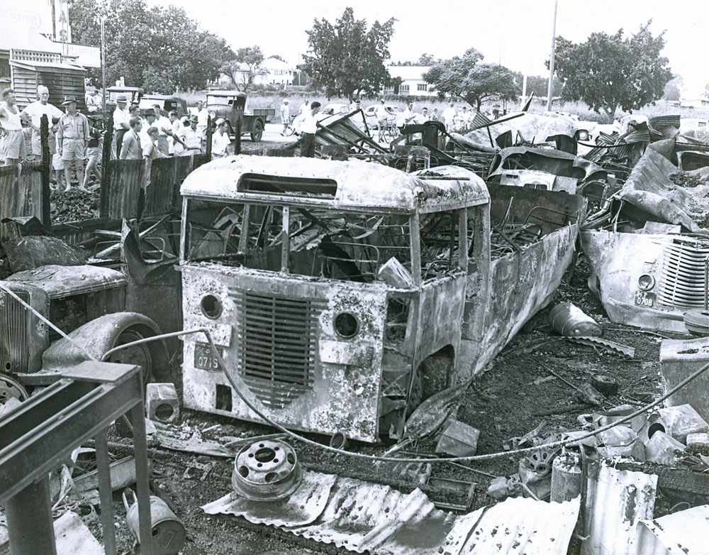 Damaged buses after fire at Booval Bus Company depot, Booval, Ipswich, 1956