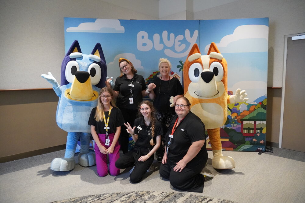 Bluey and Bingo with members of the Ipswich Libraries Programming Team, Ipswich Children's Library, Ipswich, 2022