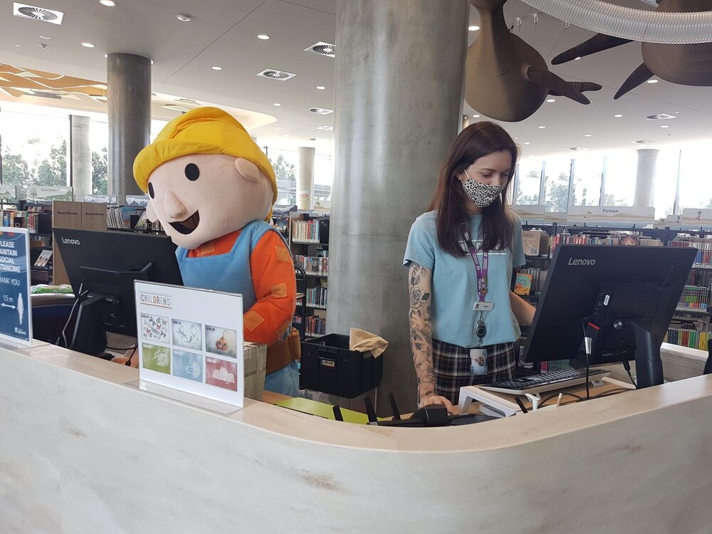 Can he fix it?  Bob the Builder working on the computer at the Ipswich Children's Library, Ipswich, 2021