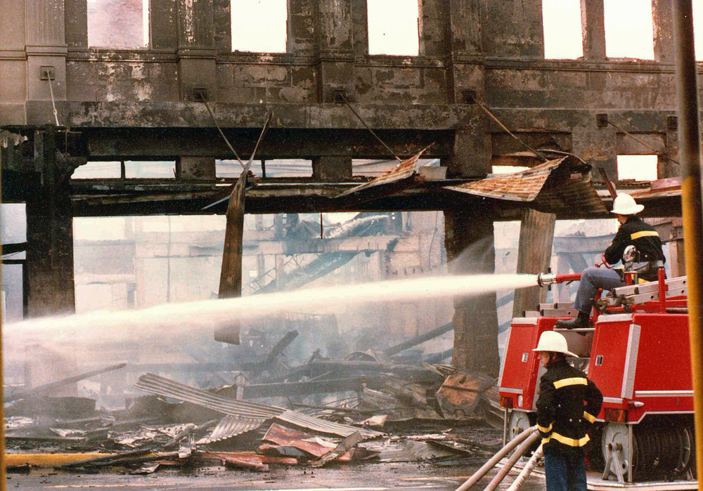 Firefighters on the site of Reid's fire, Ipswich, 1985