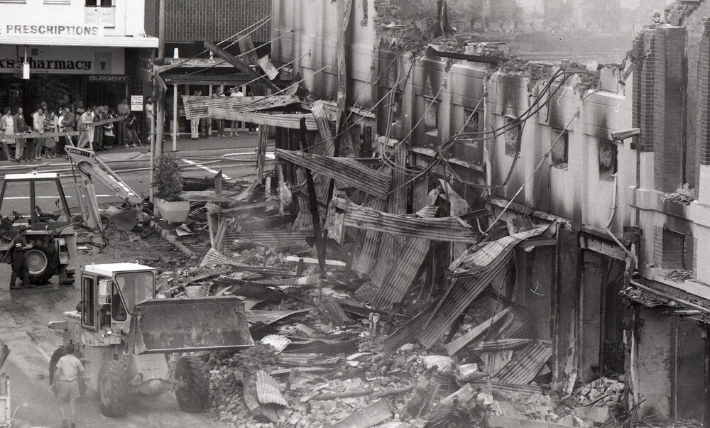 Clearing debris after the Reid's (Cribb &amp; Foote) fire, Bell Street, Ipswich, August 1985