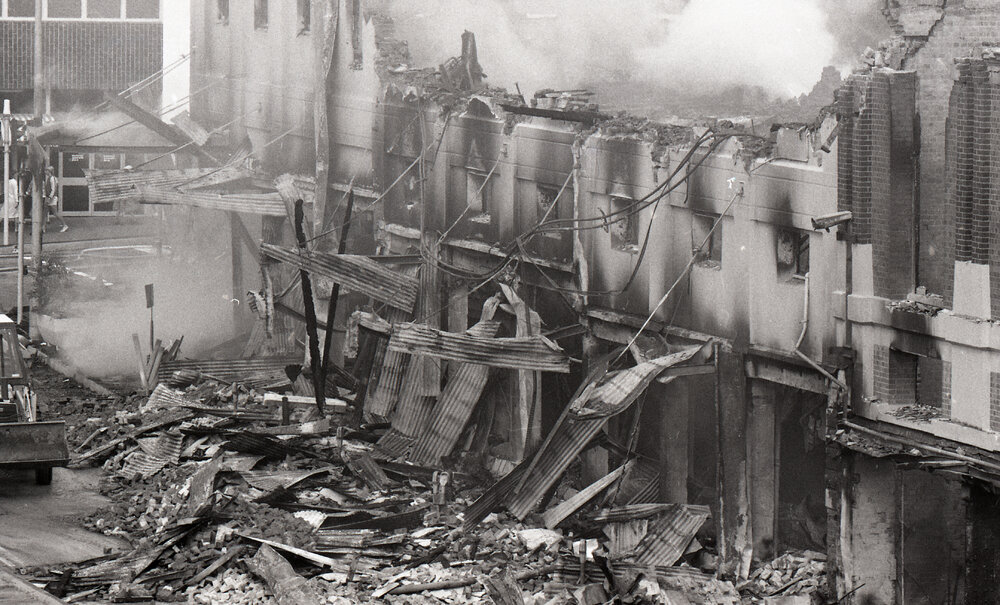 Smouldering ruins of Reid's (Cribb &amp; Foote), Bell Street, Ipswich, August 1985
