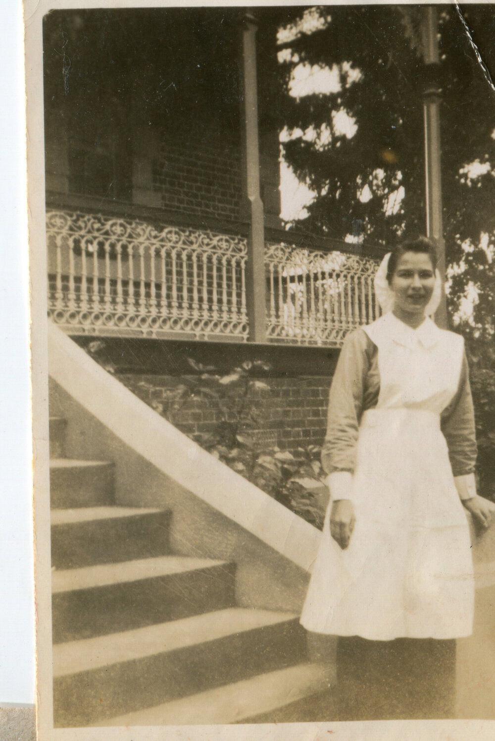 Nurse Dorothy Hayward, on the steps of the Jubilee Building, Ipswich Hospital, Ipswich, 1940s