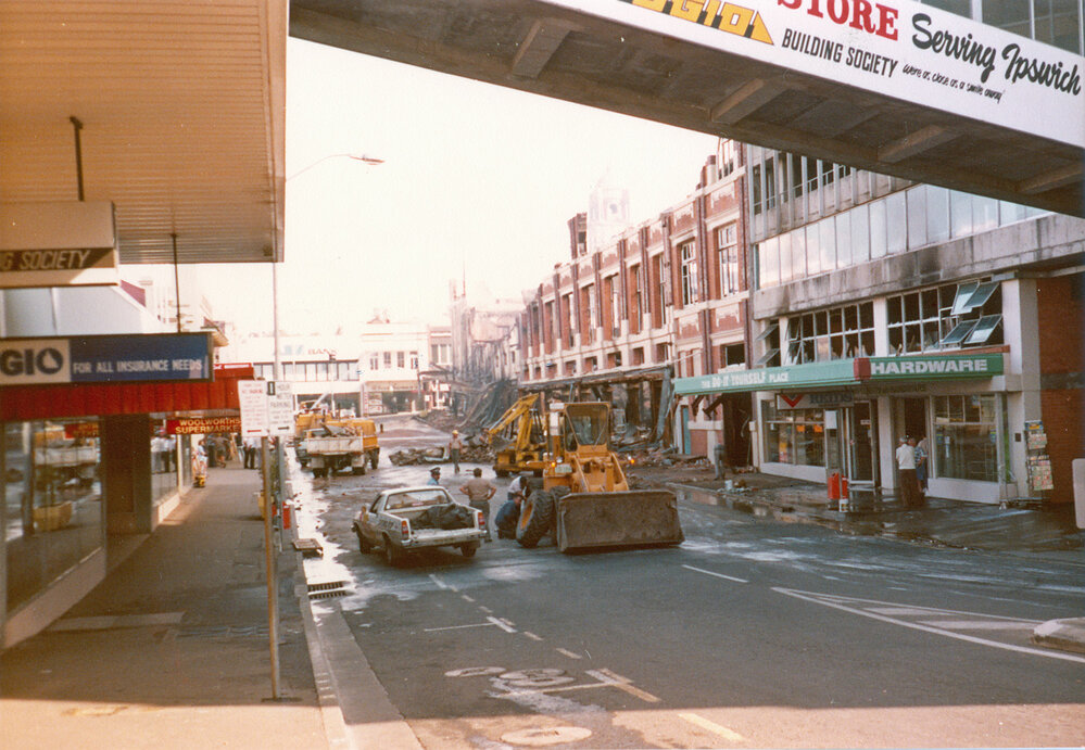 Firemen hosing down buildings in Bell Street after Reid's fire, Ipswich, 1985