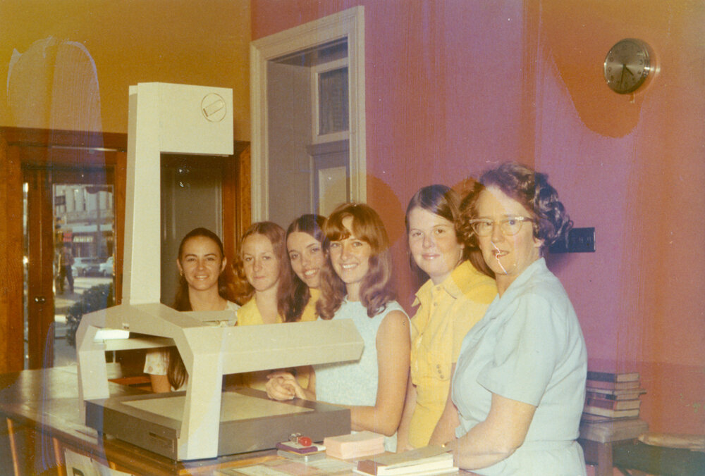 Staff of the Ipswich Municipal Library, when located on the corner of Brisbane and Nicholas Streets, Ipswich, 1970s