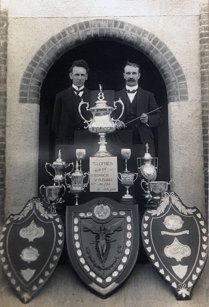 Will Jones, secretary and A. Wade, conductor, with trophies of the Ipswich City Vice-Regal Band, Ipswich, 1919