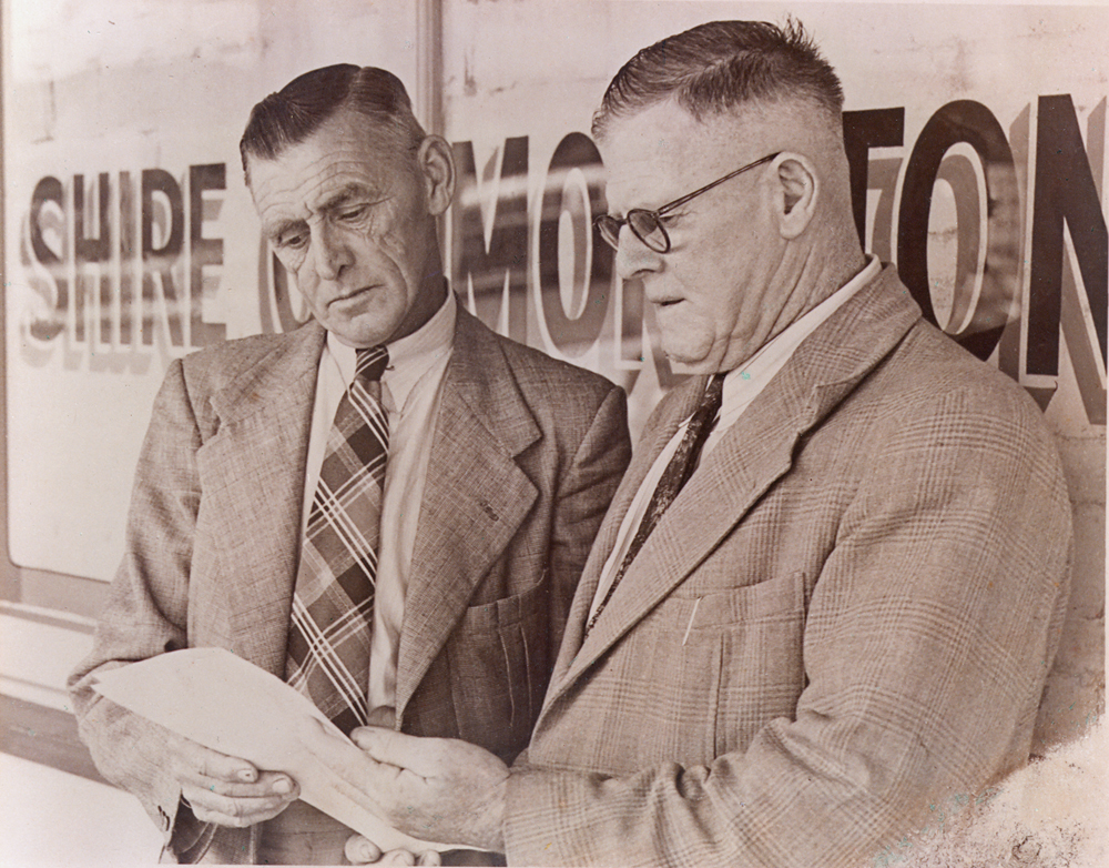 Wilfred Johnston and T. P. Nugent, outside Moreton Shire office, Ipswich, 1949